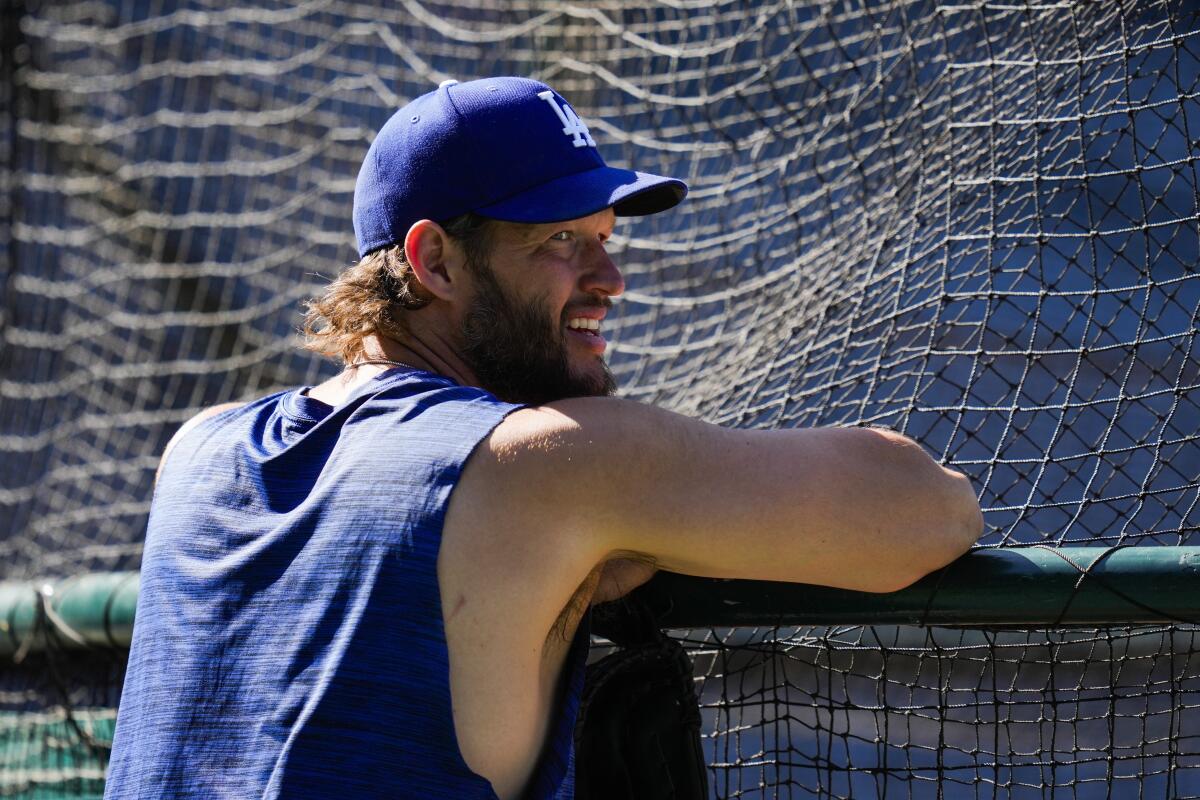 Dodgers pitcher Clayton Kershaw watches batting practice before a game against the Angels at Angel Stadium on June 21.
