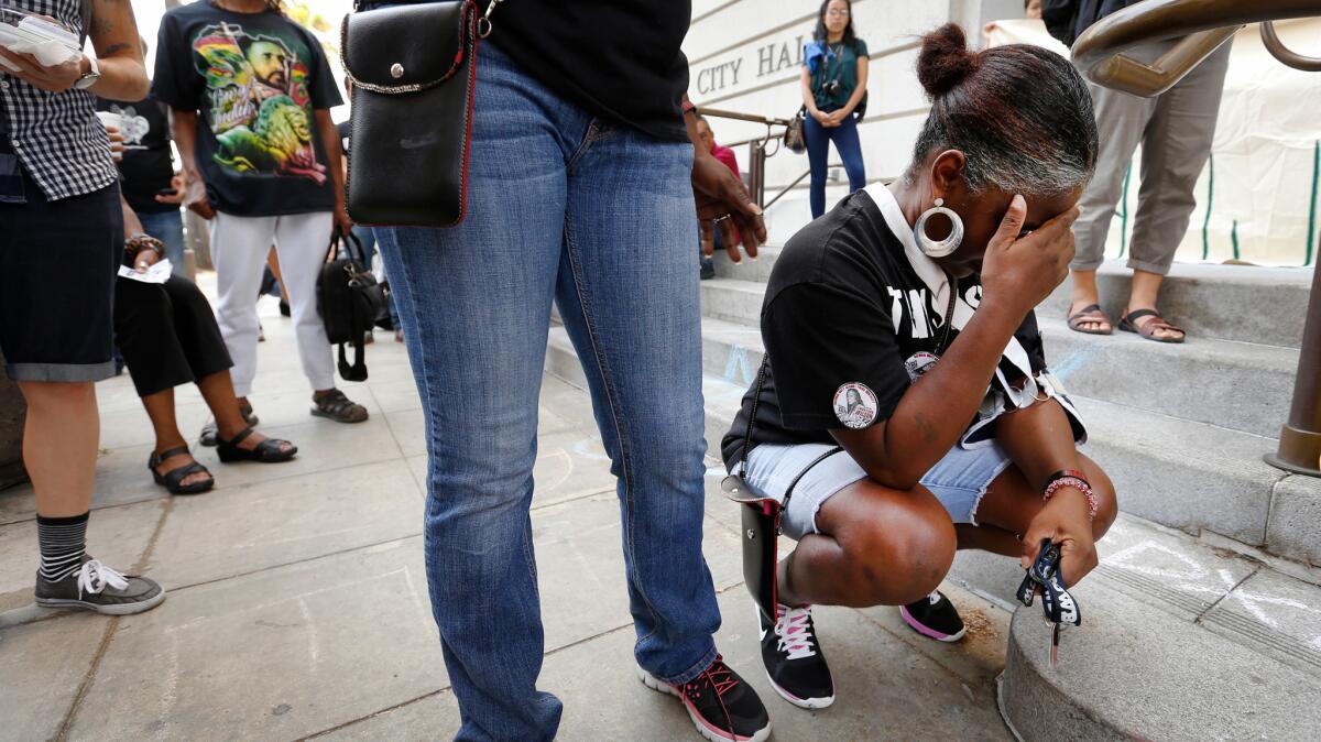 Sheila Hines, the aunt of a woman who died in an LAPD jail this year, breaks down in tears Tuesday outside City Hall after the weekly Police Commission meeting. Wakiesha Wilson's relatives have regularly attended the meetings, seeking more information about her death.