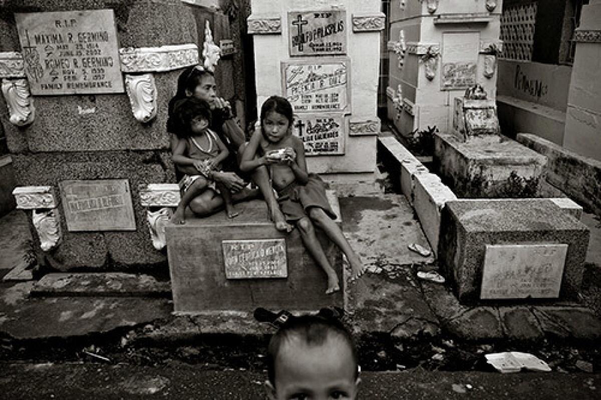 About 50,000 destitute Filipinos call a Manila cemetery home. They say it's safe and quiet, and the neighbors are nothing to be afraid of. At home among the dead.