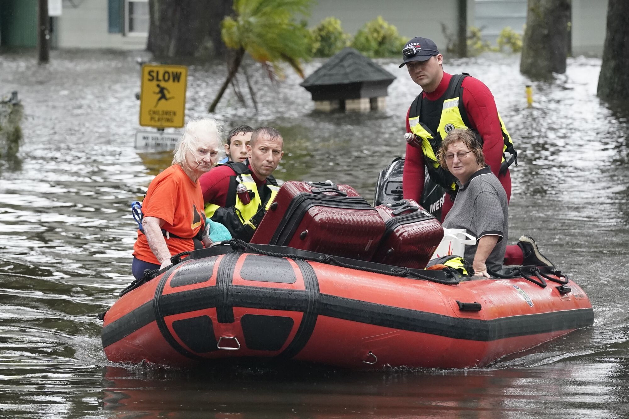 Residents are rescued from floodwaters in the aftermath of Hurricane Ian in Orlando, Fla.