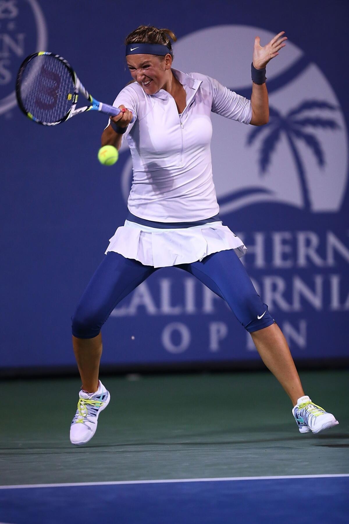 Victoria Azarenka returns a shot during her victory over Urszula Radwanska at the Southern California Open on Friday.