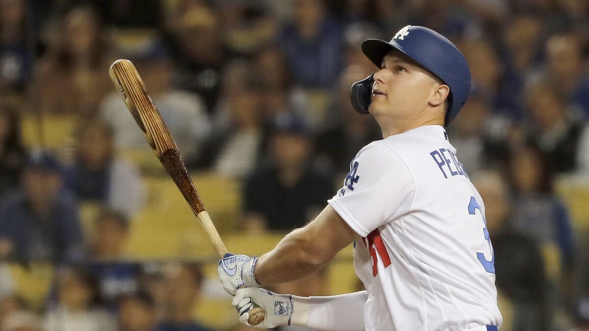 The Dodgers' Joc Pederson, here watching his two-run homer against the Giants on June 19, will participate in his second Home Run Derby on Monday night in Cleveland.