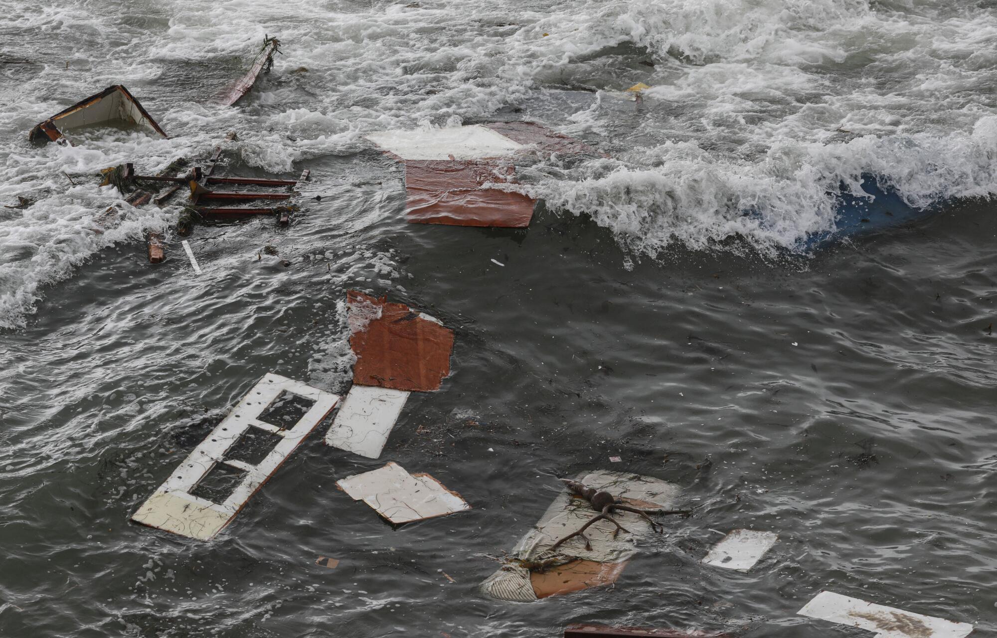 Debris is littered along the shoreline off Cabrillo Monument 