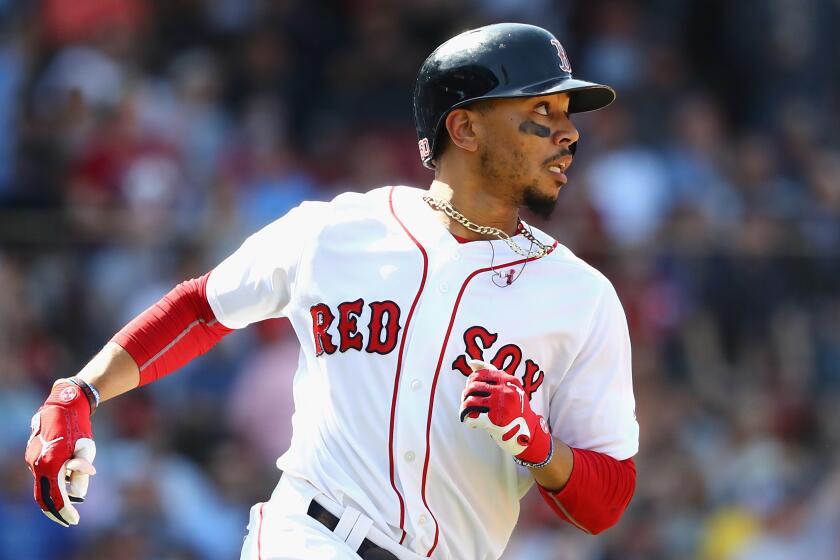 Mookie Betts of the Boston Red Sox hits a home run against the Kansas City Royals on May 2, 2018, in Boston.