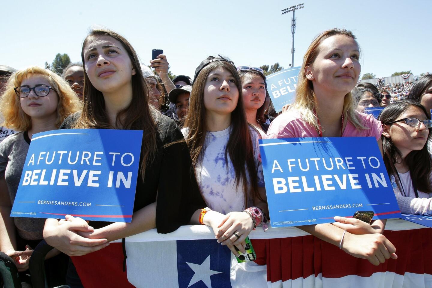 Bernie Sanders supporters listen as Democratic presidential candidate Bernie Sanders speaks.