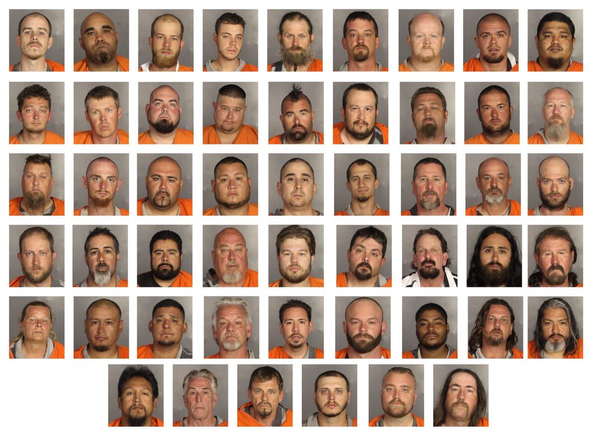 A composite image of handout booking images made available this week by the McLennan County Sheriff's Department shows scores of men arrested and charged with crimes stemming from a large shootout and fight among biker gangs outside the Twin Peaks bar and restaurant in Waco, Texas.