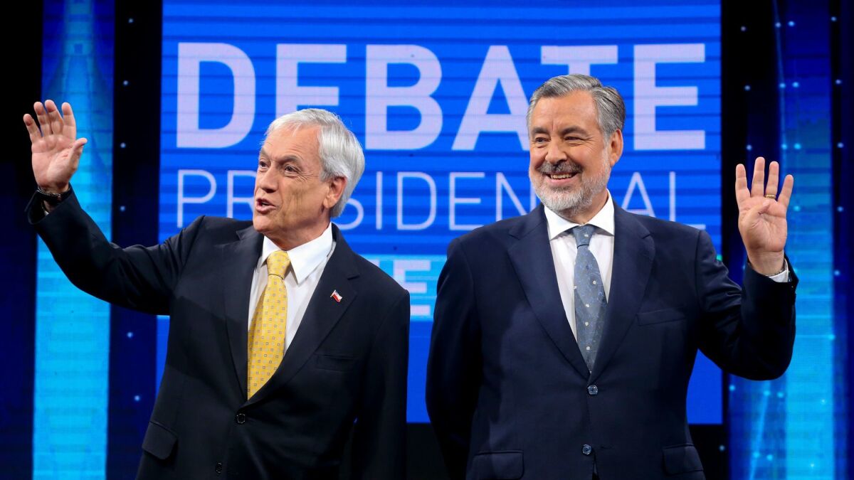 Sebastian Pinera, left, and Alejandro Guillier before the start of a presidential debate Dec. 11 in Santiago, Chile.