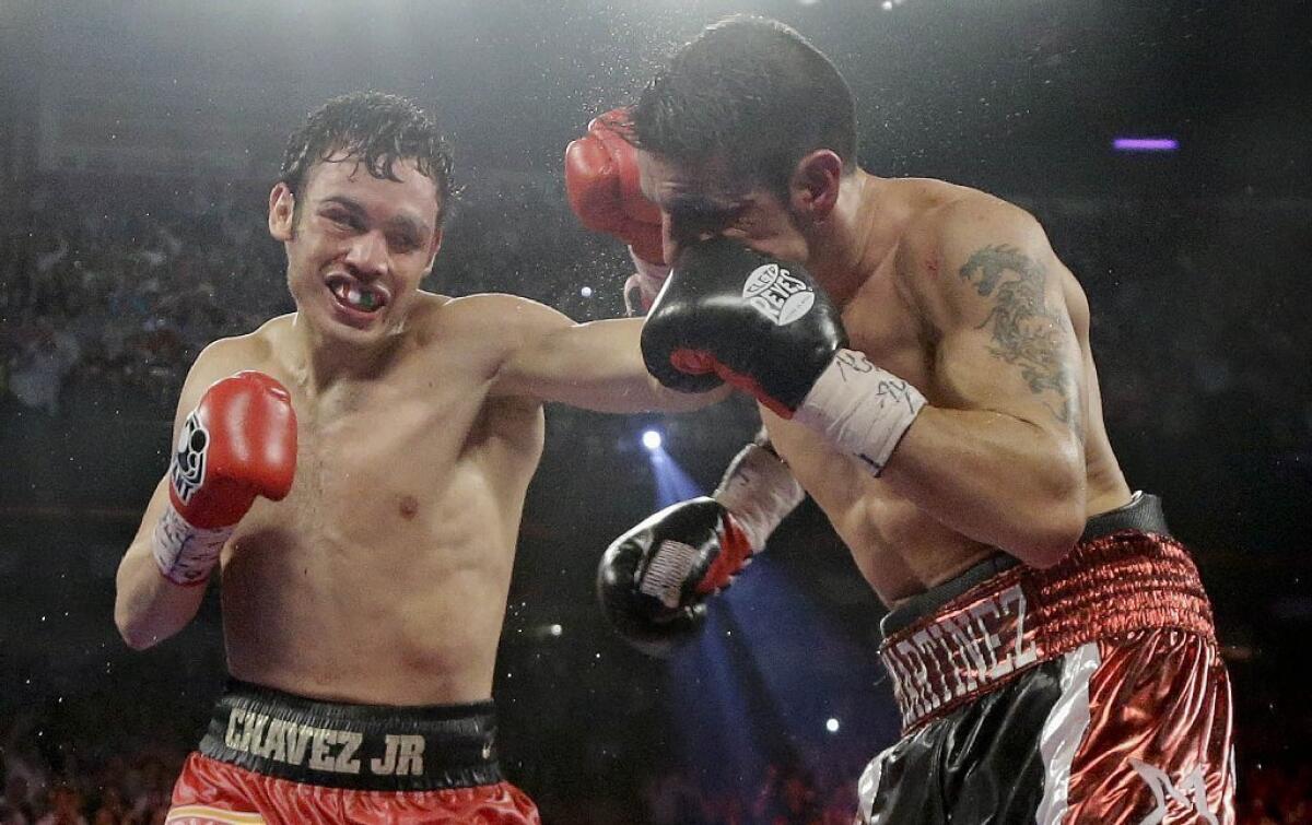 Boxer Julio Cesar Chavez Jr., left, tested positive for marijuana after suffering the first loss of his career to Sergio Martinez in September.