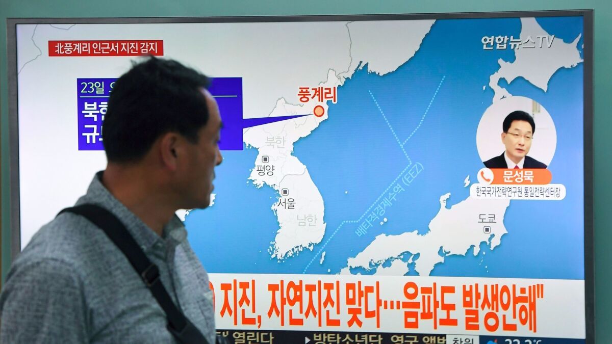 A TV inside a Seoul railway station shows news coverage of an earthquake in North Korea initially speculated to have been caused by a nuclear test.