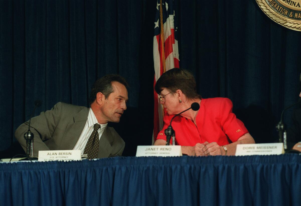 U.S. Attorney General Janet Reno and U.S. Attorney Alan Bersin confer during a briefing on the progress of Operation Gatekeeper on Oct. 14, 1995.