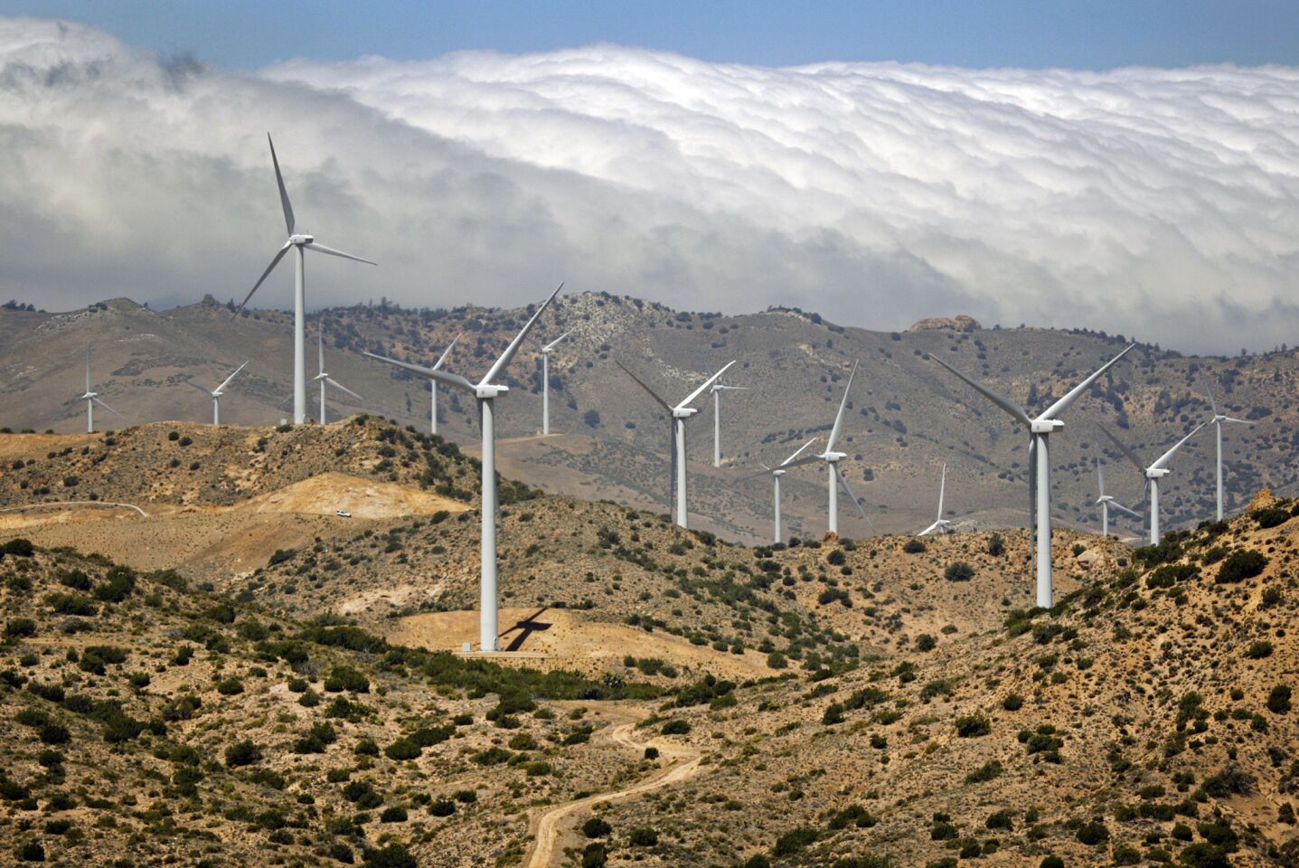 Wind turbines at the Los Angeles Department of Water and Power Pine Tree Wind Farm spin in the Tehachapi Mountains. California is looking for a reliable way to store clean energy.