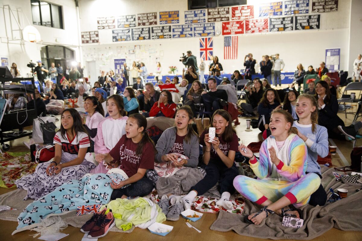 Students watch a television broadcast of the wedding at Immaculate Heart High School.