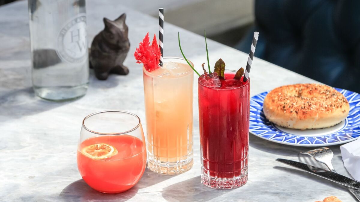 Three brunch cocktails, all from Herb & Wood: From left, Blood Orange Fennel Mimosa, Grape & Grapefruit and Beet & Gin Bloody Mary.