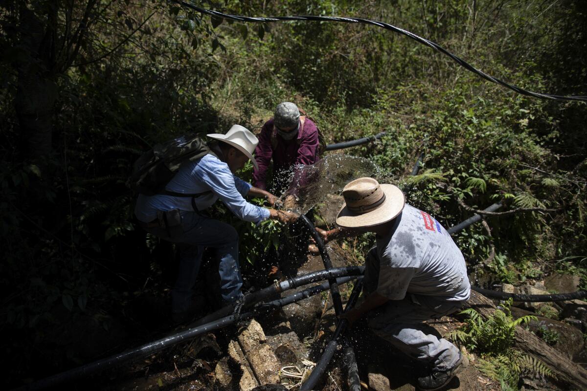 People dismantle an unlicensed water intake in Mexico.