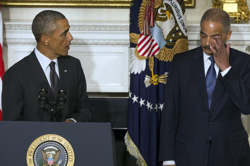 President Obama, with Atty. Gen. Eric H. Holder Jr., speaks in the State Dining Room at the White House to announce Holder's resignation in September.