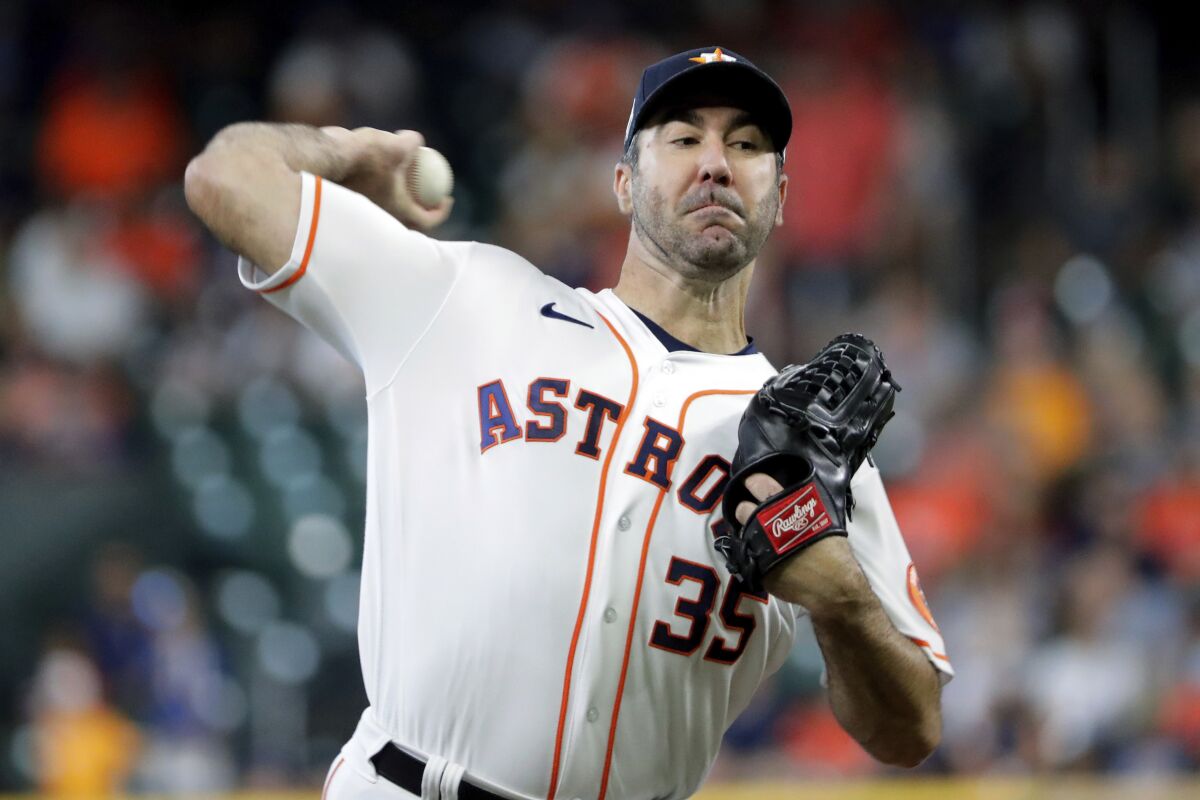 Houston Astros starting pitcher Justin Verlander (35) throws against the Kansas City Royals during the first inning of a baseball game Thursday, July 7, 2022, in Houston. (AP Photo/Michael Wyke)