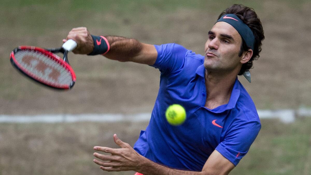 Roger Federer serves during his semifinal victory over Ivo Karlovic at the Gerry Weber Open in Halle, Germany, on Saturday.