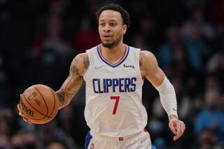 Los Angeles Clippers guard Amir Coffey (7) brings the ball upcourt