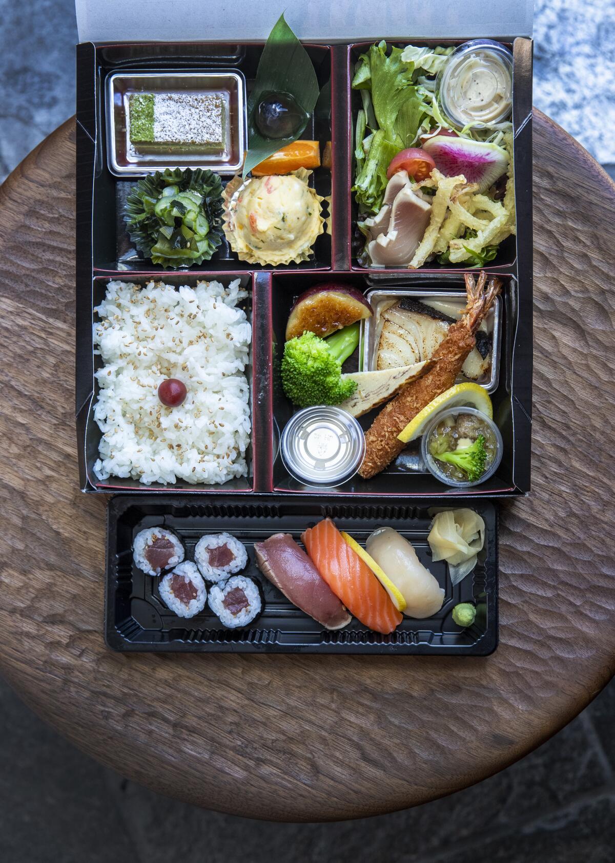 n/naka's $38 bento box with sushi and an assortment of Japanese comfort foods.