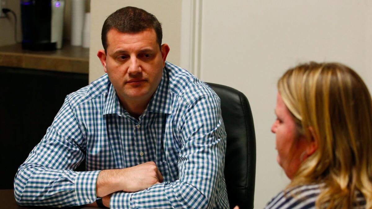 Rep. David Valadao (R-Hanford) meets a constituent during district meetings last month. The last two GOP presidential candidates lost in his district by double digits.