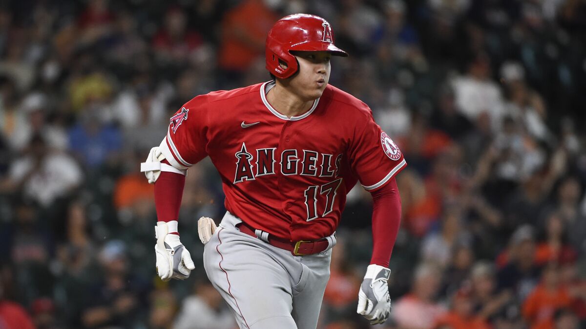 Angels star Shohei Ohtani runs to first base during a game.