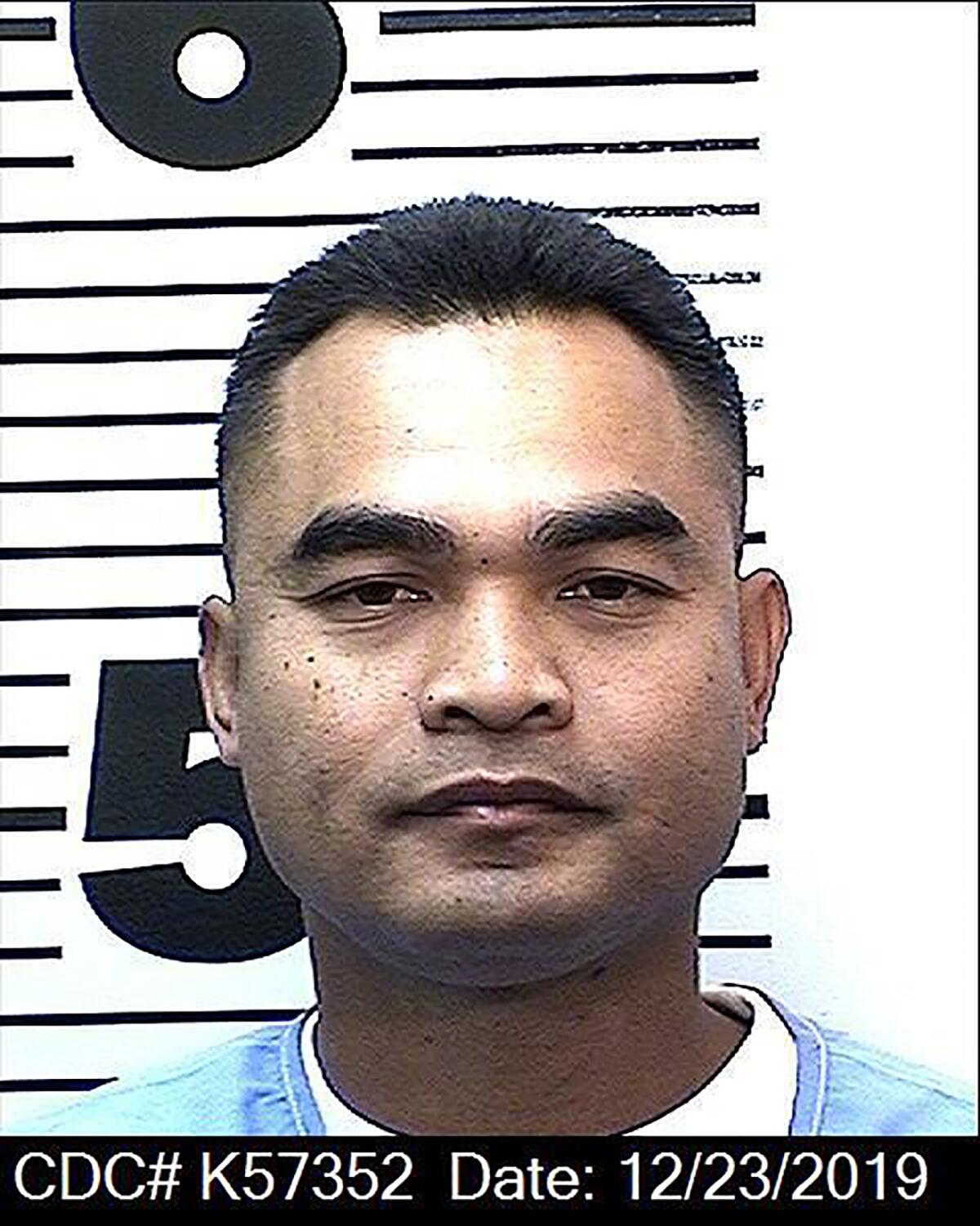 Tith Ton, who spent 22 years in prison, was released Monday on parole and immediately turned over to federal agents for possible deportation, according to his attorney.