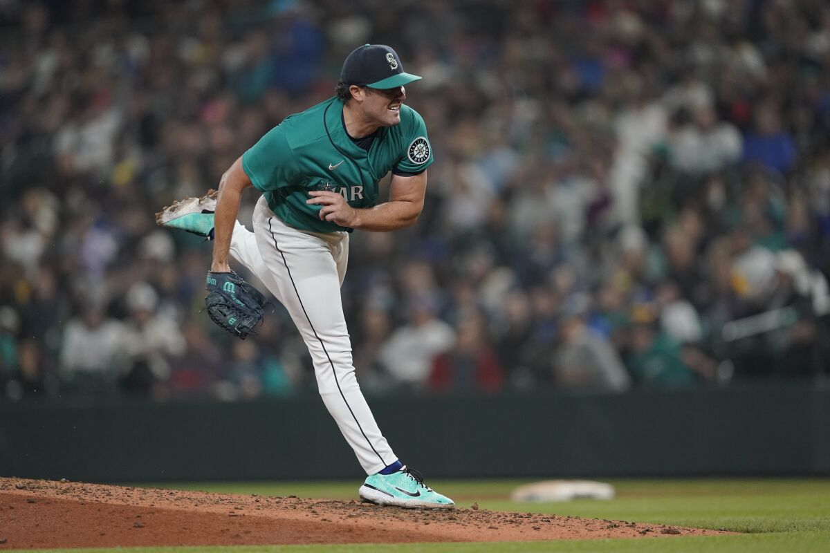 Seattle Mariners starting pitcher Robbie Ray delivers after Angels batter Max Stassi broke up a no-hitter.