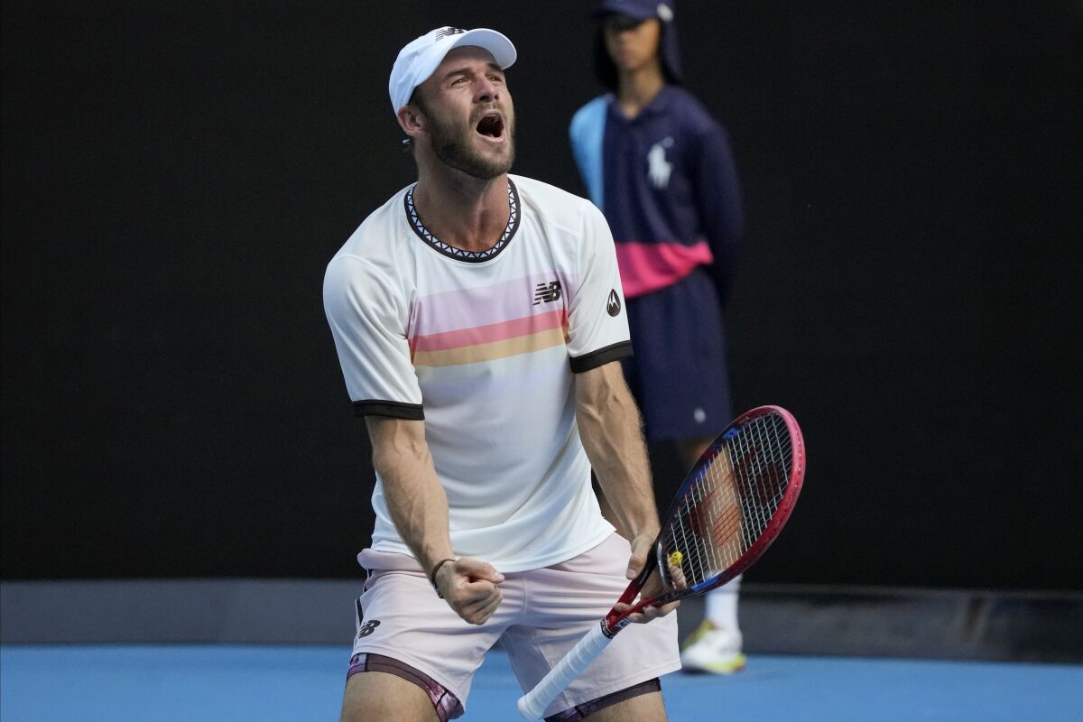 Tommy Paul of the U.S. celebrates after defeating compatriot Ben Shelton in their quarterfinal match at the Australian Open tennis championship in Melbourne, Australia, Wednesday, Jan. 25, 2023. (AP Photo/Dita Alangkara)