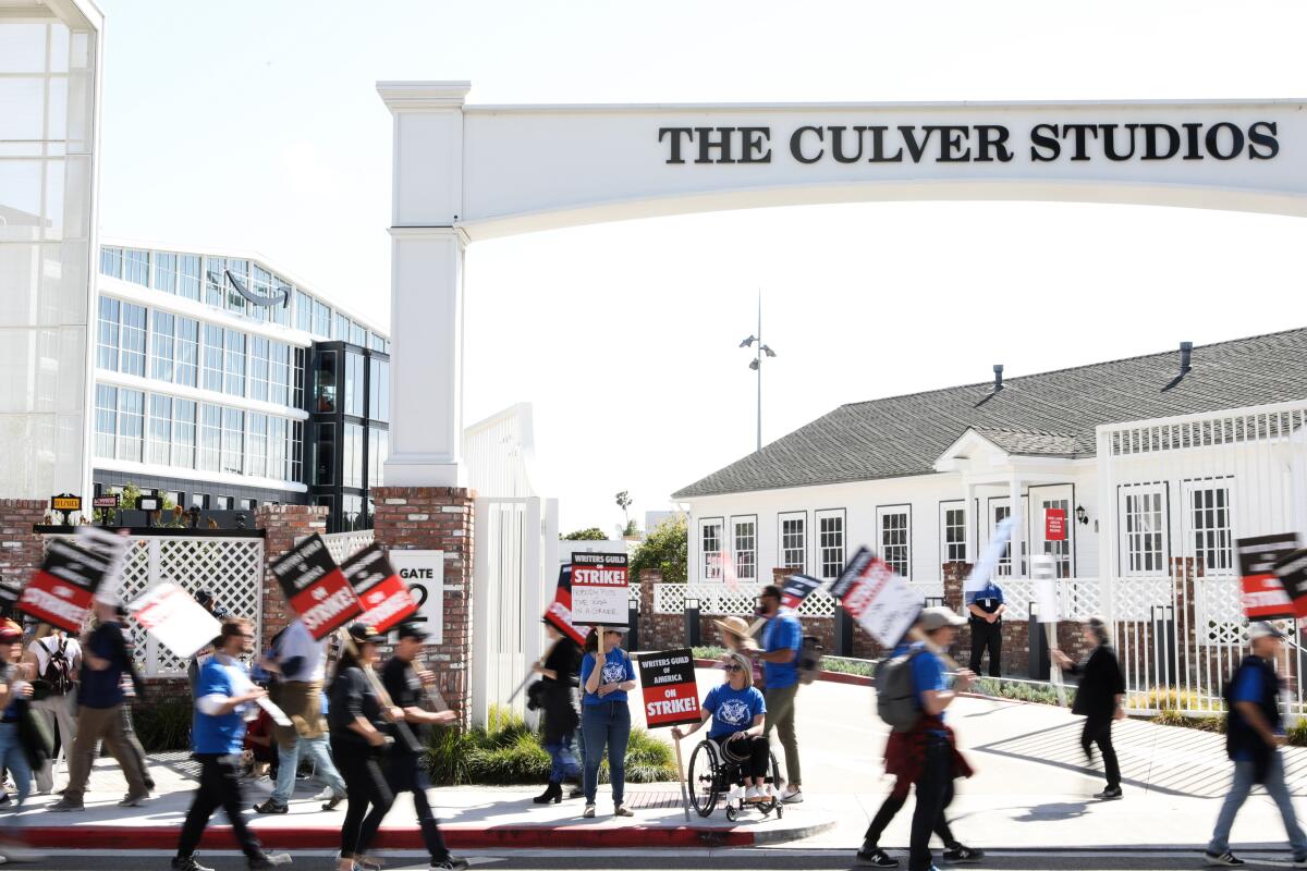 Writers Guild members picket in front of Amazon studios in Culver City.
