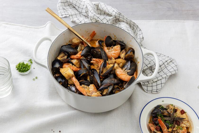 LOS ANGELES, CALIFORNIA - Jan. 23, 2020: Ben Mims' Cajun Seafood Stew served with a side of Spicy Sausage, Crispy Okra, and Rice photographed on Thursday, Jan. 23, 2020, at PropLink studio in Arts District, Los Angeles. Food Stylist: Ben Mims, Prop Stylist: Rebecca Buenik. (Silvia Razgova / For The Times) Assignment ID: 479829