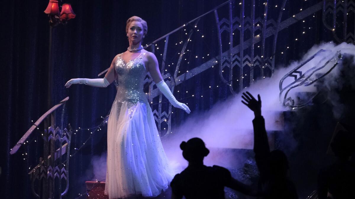Cinderella (Ashley Shaw) descends the stairs at the ball in Matthew Bourne's reimagining of "Cinderella," now at the Ahmanson Theatre in Los Angeles through March 10.