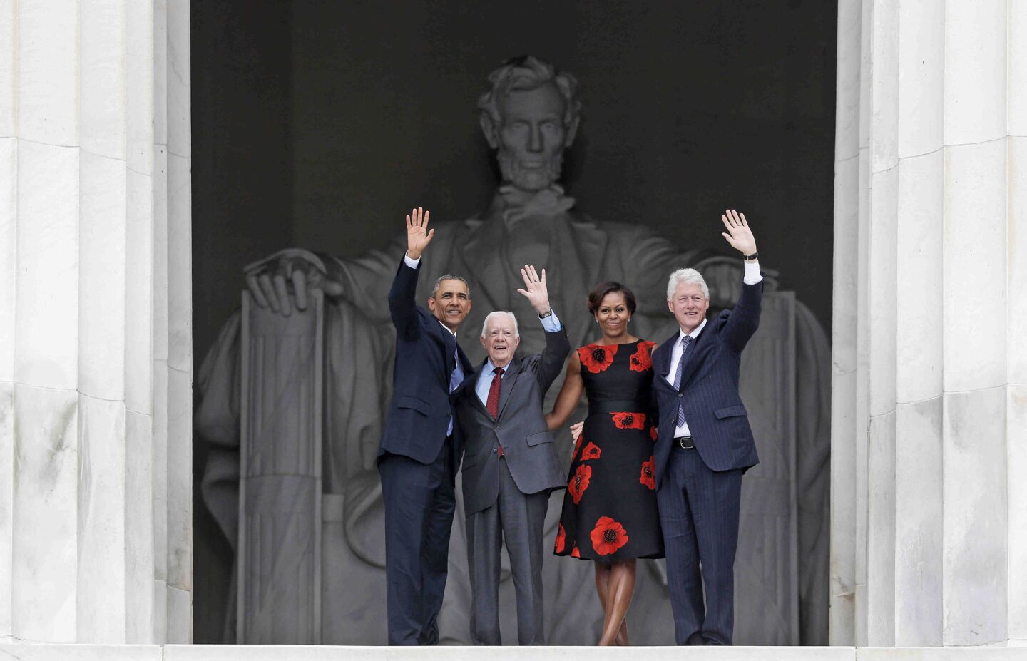 President Obama, first lady Michelle Obama and former presidents Jimmy Carter and Bill Clinton wave as they leave 50th anniversary celebration of the March on Washington.