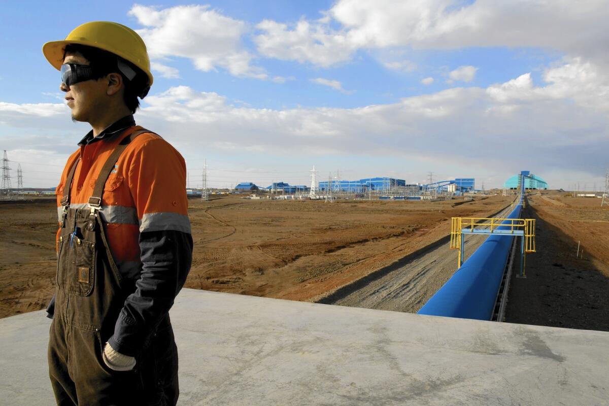 A Mongolian worker at the giant Oyu Tolgoi gold and copper mine in the Gobi desert in 2012.
