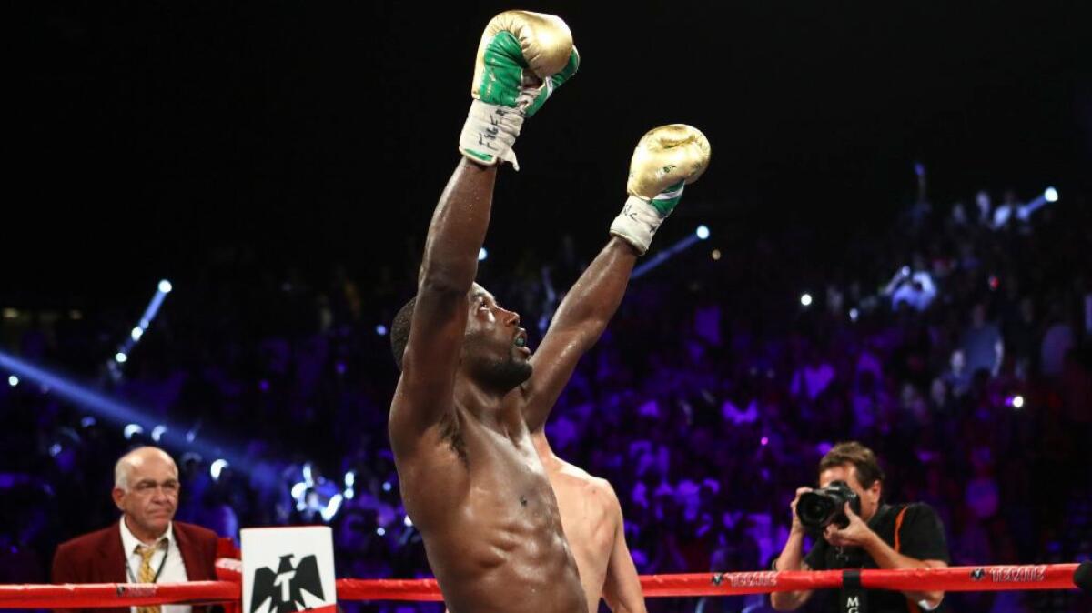 Terence Crawford celebrates after his victory over Viktor Postol by unanimous decision in Las Vegas on July 23.
