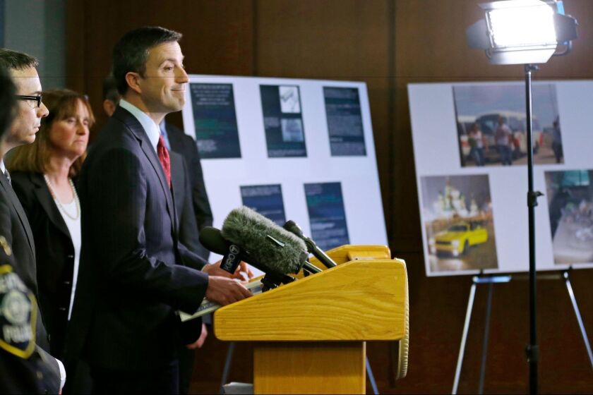 Trevor McFadden acting principal deputy assistant attorney general, smiles as he talks to, Friday, April 21, 2017, in Seattle, about the federal court sentencing of Roman Seleznev to 27 years in prison after he was convicted of hacking into U.S. businesses to steal credit card data. (AP Photo/Ted S. Warren)