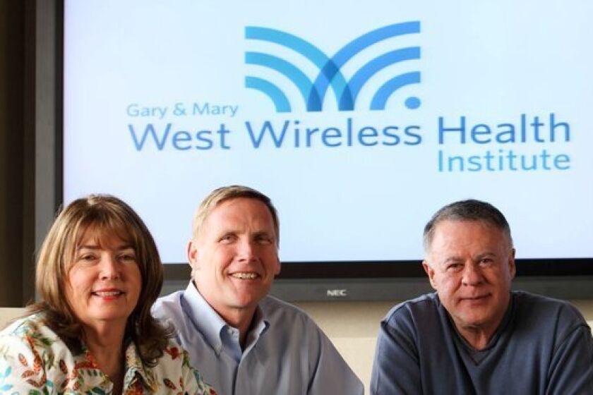 Donald Casey Jr., formerly of West Health Institute, shown at center, between funders Gary and Mary West