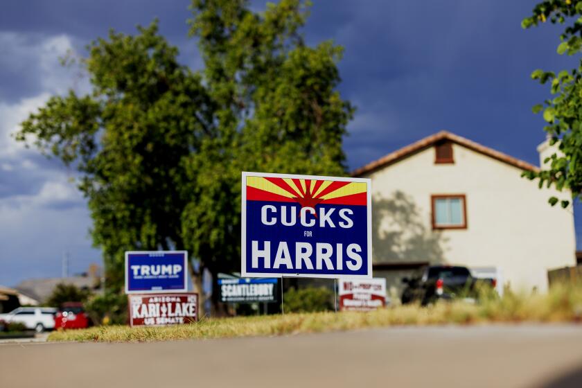 MESA, AZ - OCTOBER 1, 2024: After Mesa city council member and Mormon Julie Spilsbury put up a "Republicans for Harris-Walz" sign in her front yard, her neighbor across the street, who is a Trump supporter put up this derogatory "Cucks for Harris" sign on October 1, 2024 in Mesa, Arizona. (Gina Ferazzi / Los Angeles Times)