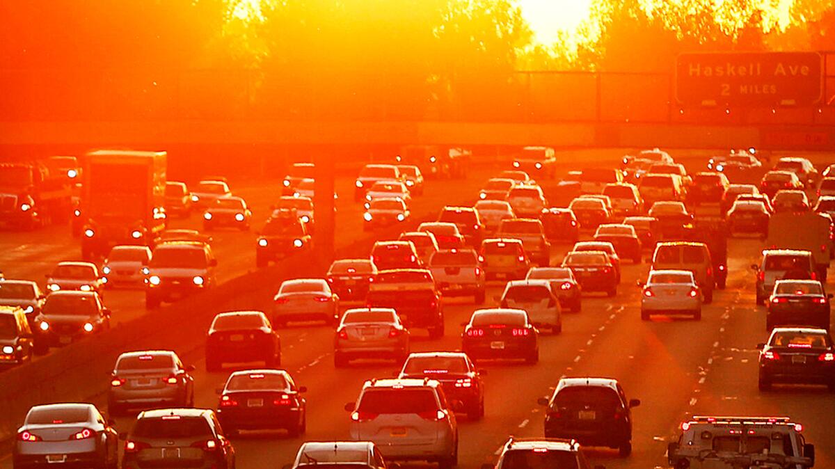 The sun rises as traffic begins to swell on the 101 Freeway in the San Fernando Valley in March 2015.