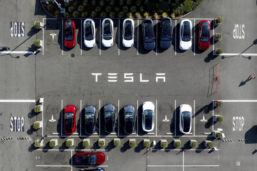 Tesla vehicles line a parking lot at the company's Fremont, Calif., factory as Israeli Prime Minister Benjamin Netanyahu visits the facility on Monday, Sept. 18, 2023. (AP Photo/Noah Berger)