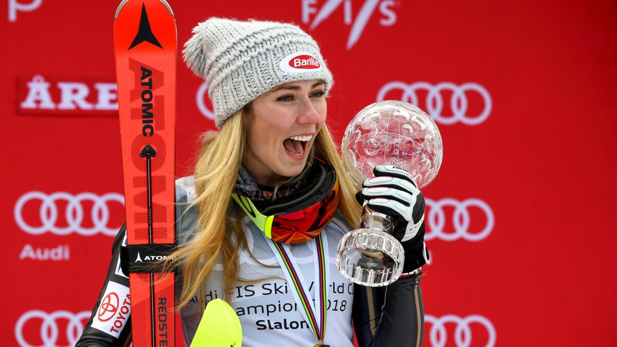 Mikaela Shiffrin celebrates on the podium after winning the slalom race at the World Cup finals on Saturday.