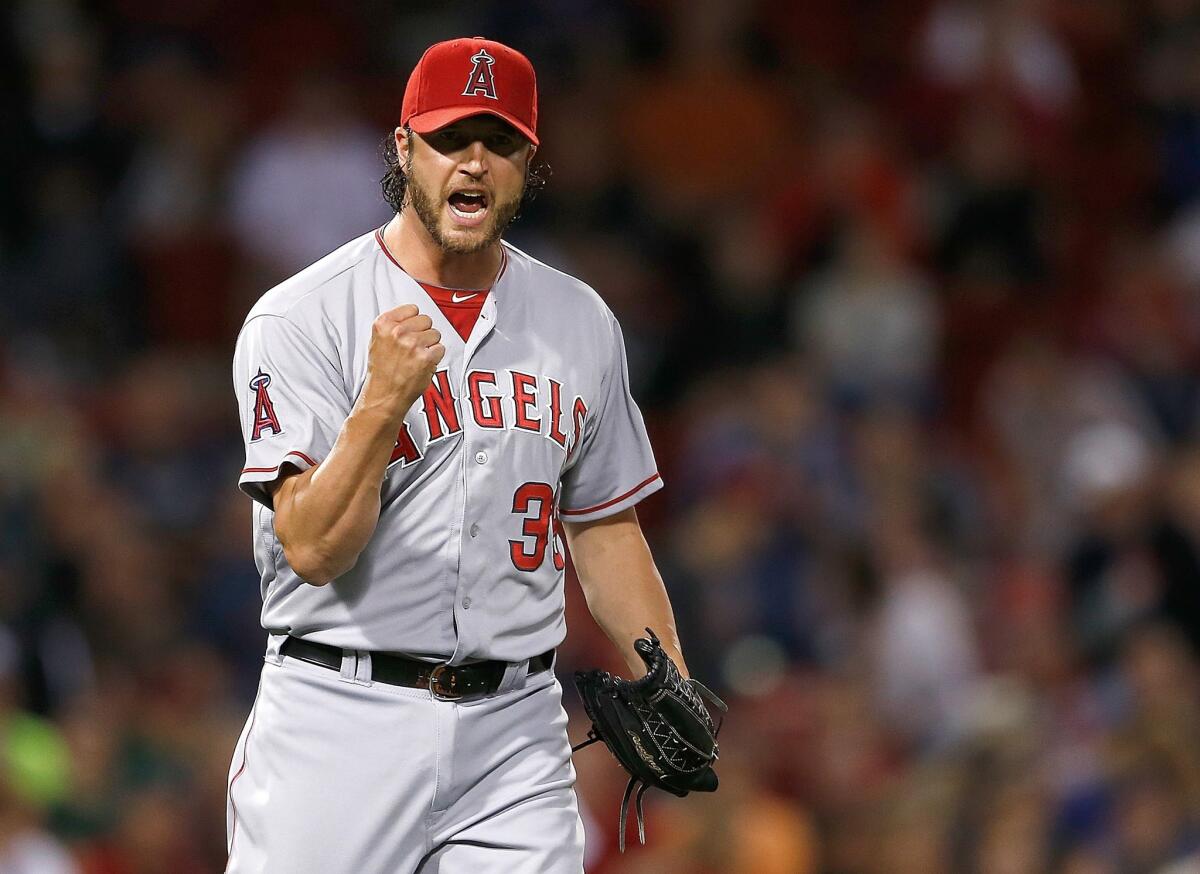Jason Grilli celebrates after recording his first save with the Angels in a 2-0 victory Thursday over the Boston Red Sox.