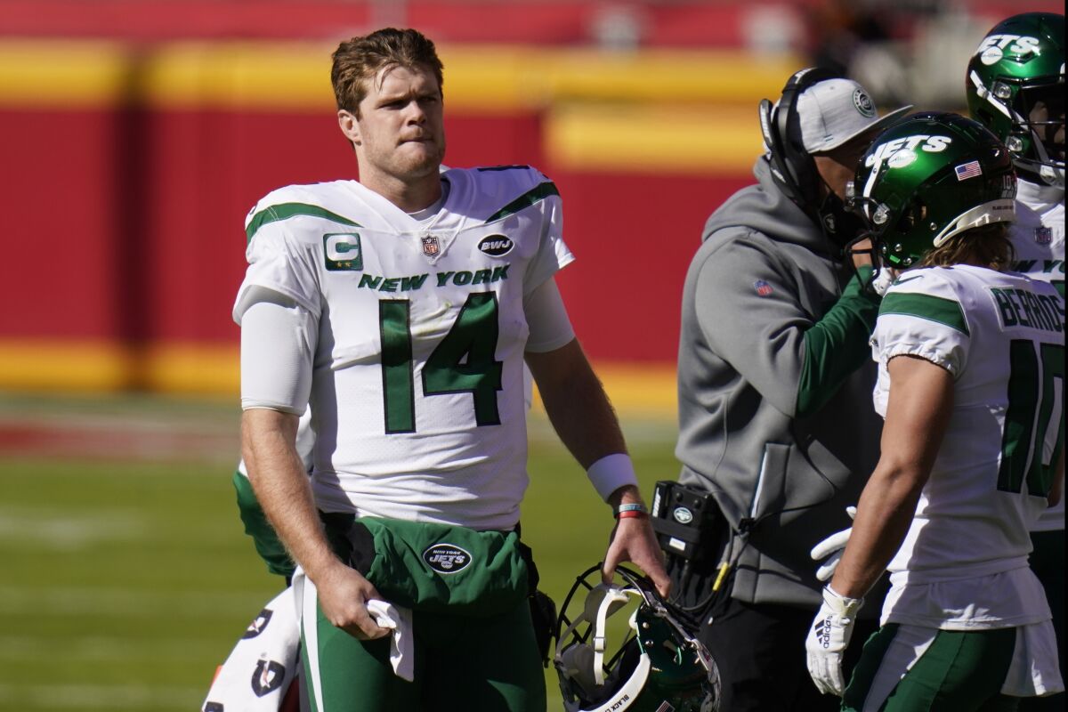 New York Jets quarterback Sam Darnold (14) stands on the sideline in the first half of an NFL football game against the Kansas City Chiefs on Sunday, Nov. 1, 2020, in Kansas City, Mo. (AP Photo/Jeff Roberson)