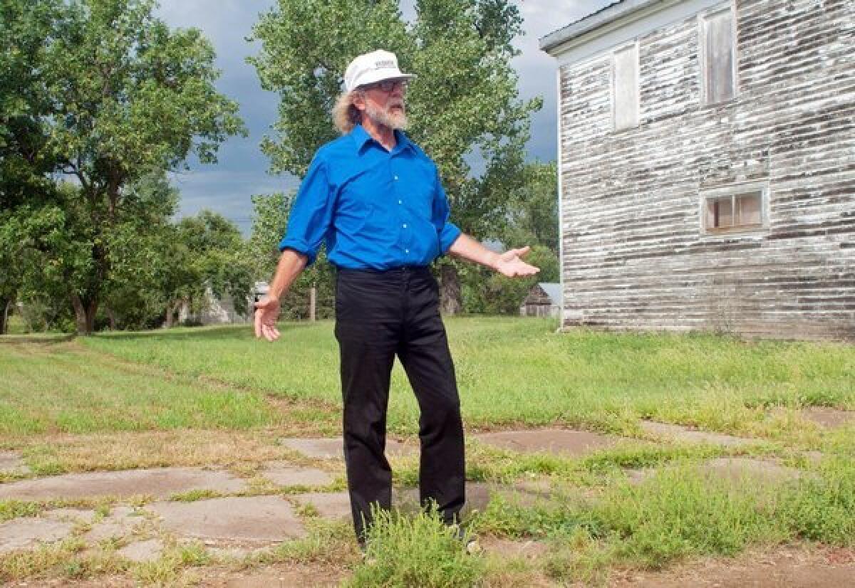 Craig Cobb stands in an empty lot he owns on Main Street in Leith, N.D. Cobb wrote on a white supremacist message board that "we could declare a Mexican illegal invaders and Israeli Mossad/IDF spies no-go zone."