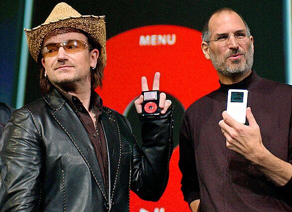 Bono, of the band U2, and Jobs hold up iPods at an unveiling of a new branded iPod in San Jose.