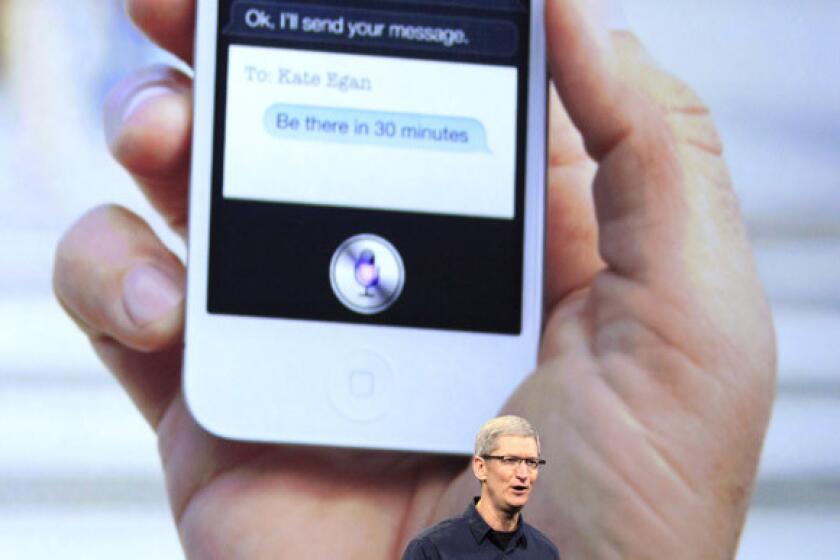 Apple CEO Tim Cook talks about the company's Siri feature during an event in San Francisco to unveil the new iPad.