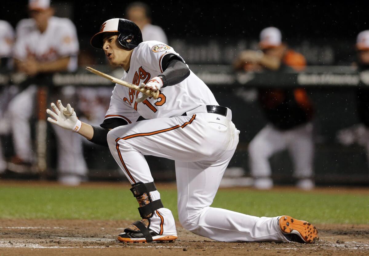 Baltimore's Manny Machado hurts his right knee during an at-bat on Aug. 11.