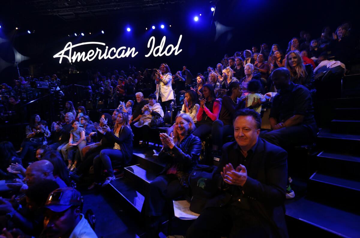 Members of the audience applaud during a dress rehearsal for the March 24 episode of "American Idol."