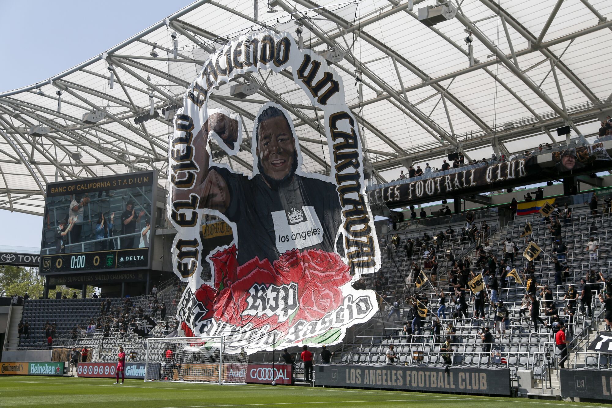 A giant banner with the picture of Mauricio "Mo" Fascio at Banc of California Stadium.