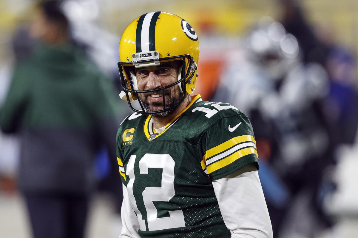 FILE - In this Dec 19. 2020, file photo, Green Bay Packers quarterback Aaron Rodgers (12) smiles before an NFL football game against the Carolina Panthers in Green Bay, Wis. After a tumultuous offseason in which his future with the Packers appeared in doubt, reigning MVP Aaron Rodgers is ready to begin his 17th – and perhaps final – season in Green Bay. (AP Photo/Jeffrey Phelps, File)