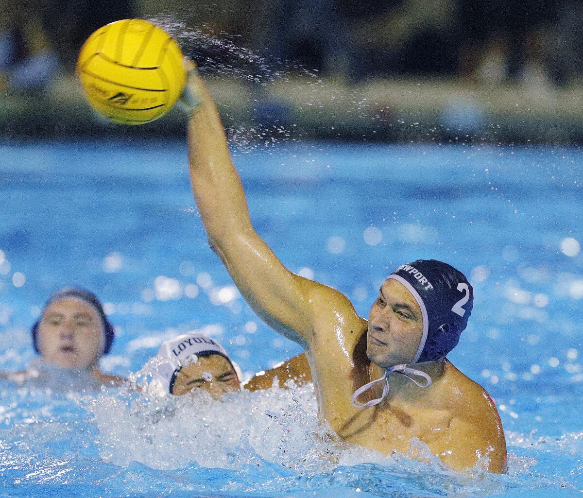 Newport Harbor's Makoto Kenney shoots and scores against Loyola in the second half of the CIF Southern Section Division 1 semifinal playoff match at Woollett Aquatics Center in Irvine on Wednesday.